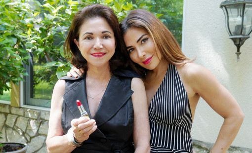 Mother and daughter wearing red lipstick.